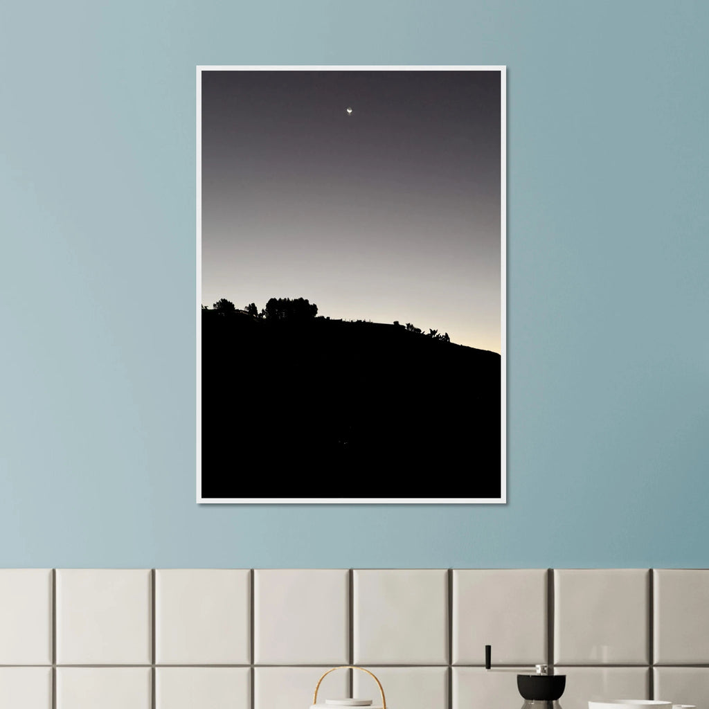 Black and white semi-glossy poster print of Hollywood Hills with new moon, framed in wood, from the Fall California Series.