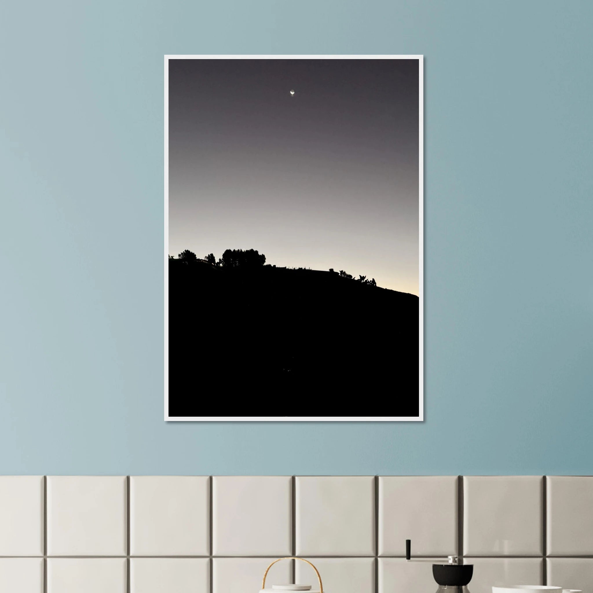 Black and white semi-glossy poster print of Hollywood Hills with new moon, framed in wood, from the Fall California Series.