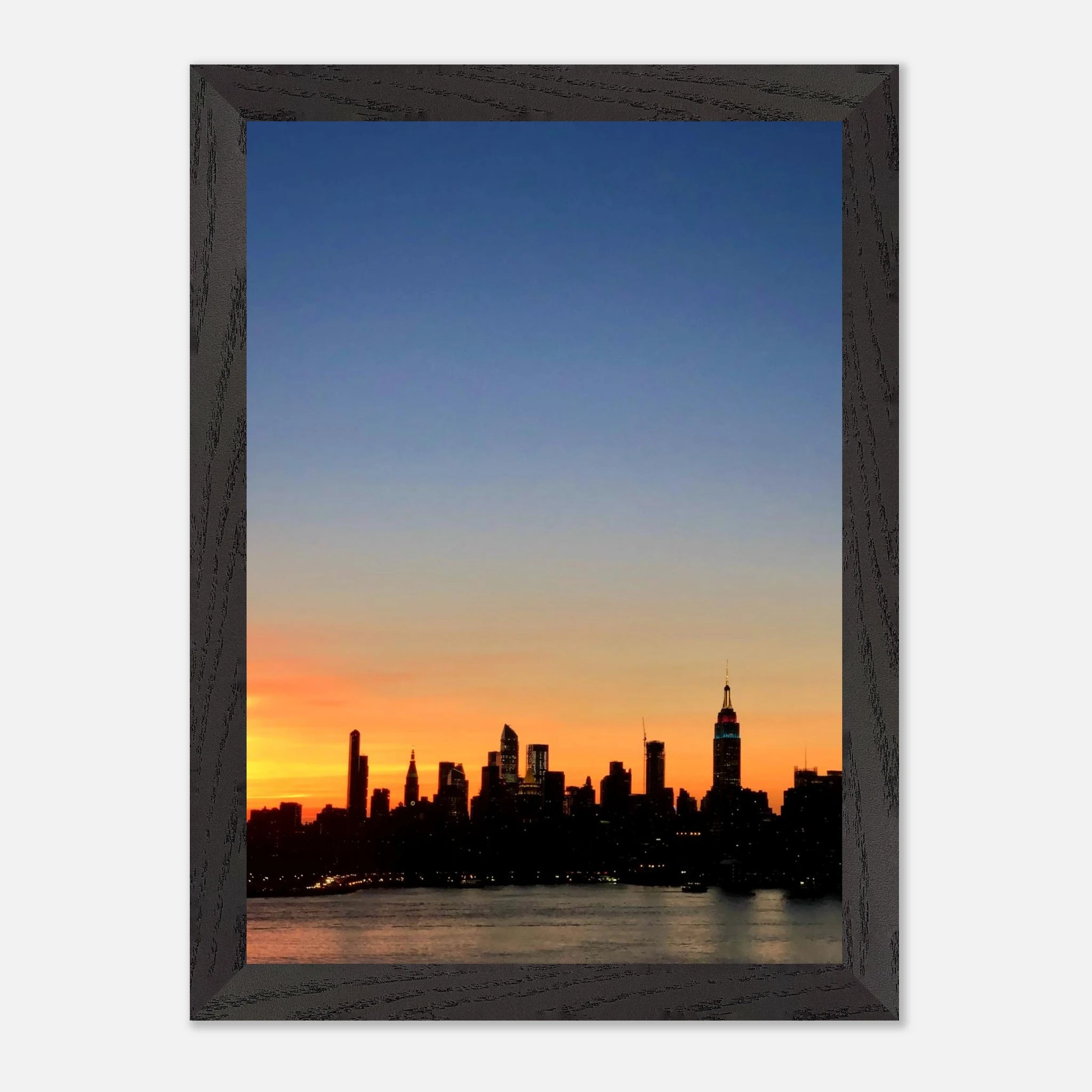 Wooden framed Manhattan skyline sunset poster, travel collection wall art, featuring vibrant cityscape at dusk for home decor.