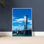 Framed urban photography print of NYC Manhattan Bridge and East River, showcasing iconic cityscape and bridge details.