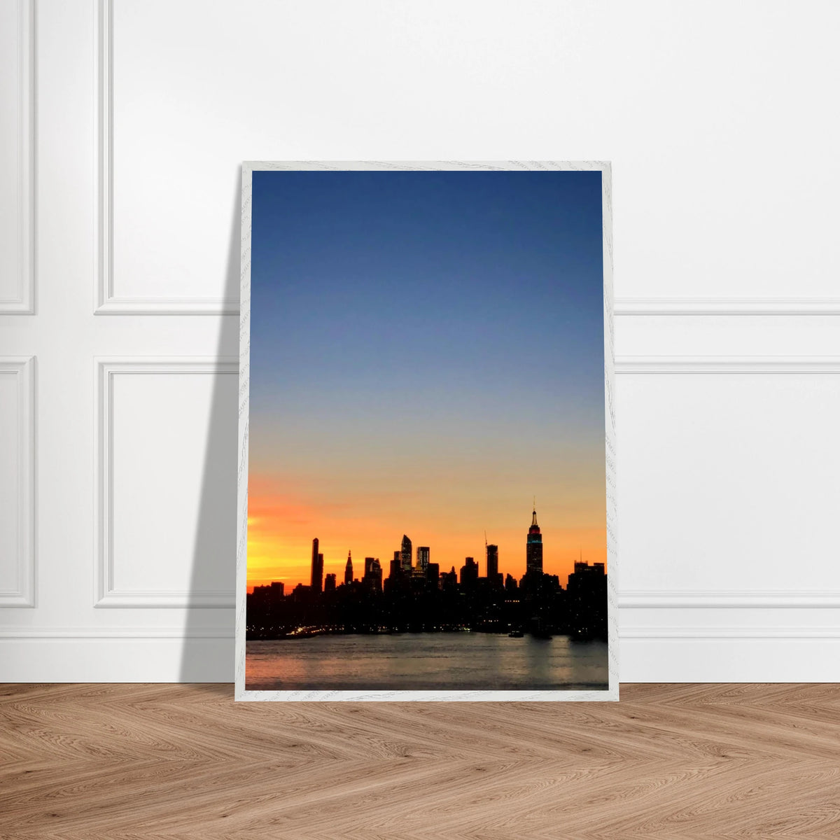 Manhattan Skyline Sunset framed poster featuring NYC skyline and vibrant sunset colors, ready to hang as wall art.