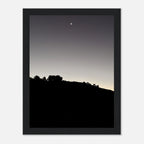 Black and white semi-glossy poster of Hollywood Hills with a new moon, framed in wood, from the Fall Hollywood Hills series.