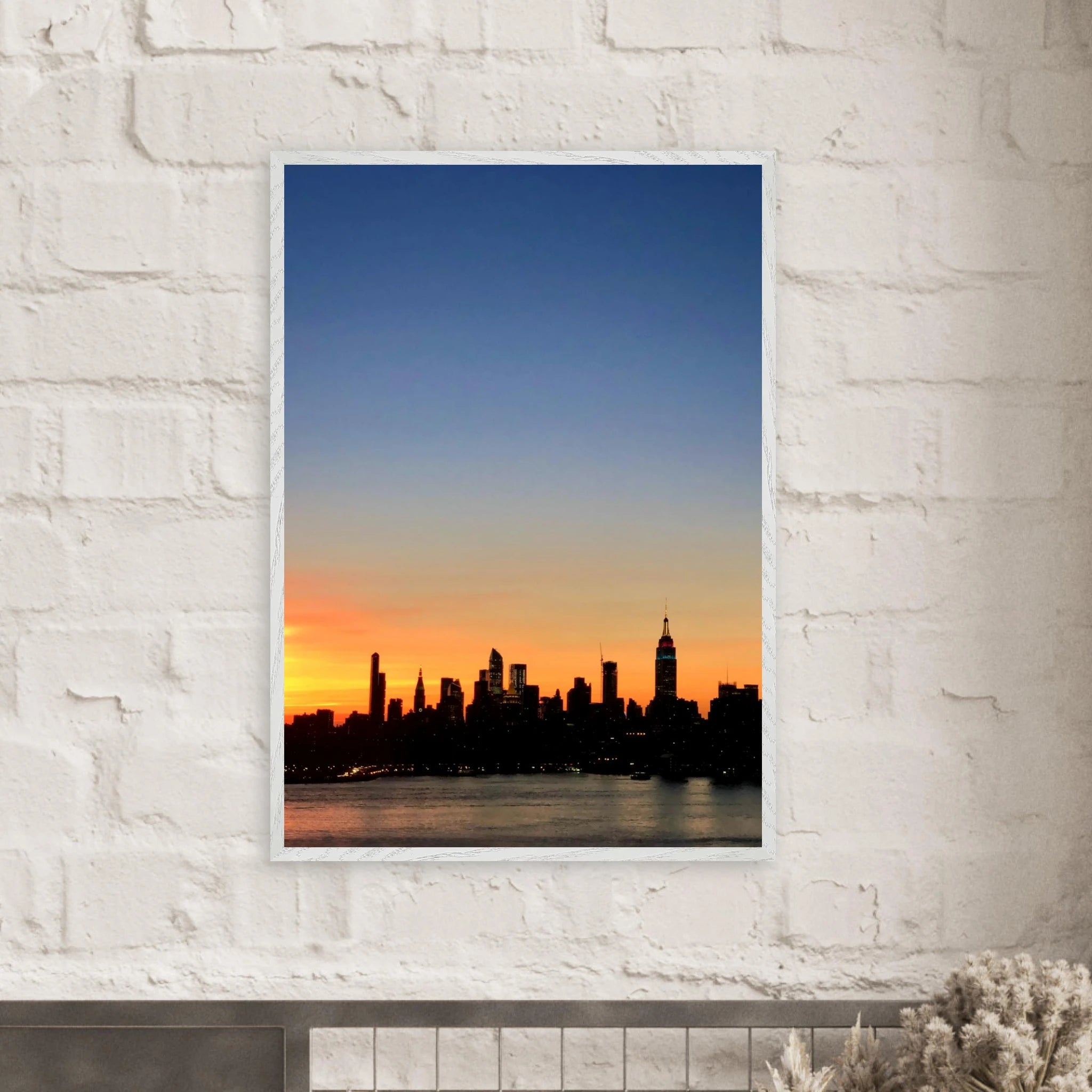 Wooden framed Manhattan Skyline sunset poster featuring vibrant cityscape, perfect for stylish home wall decor.