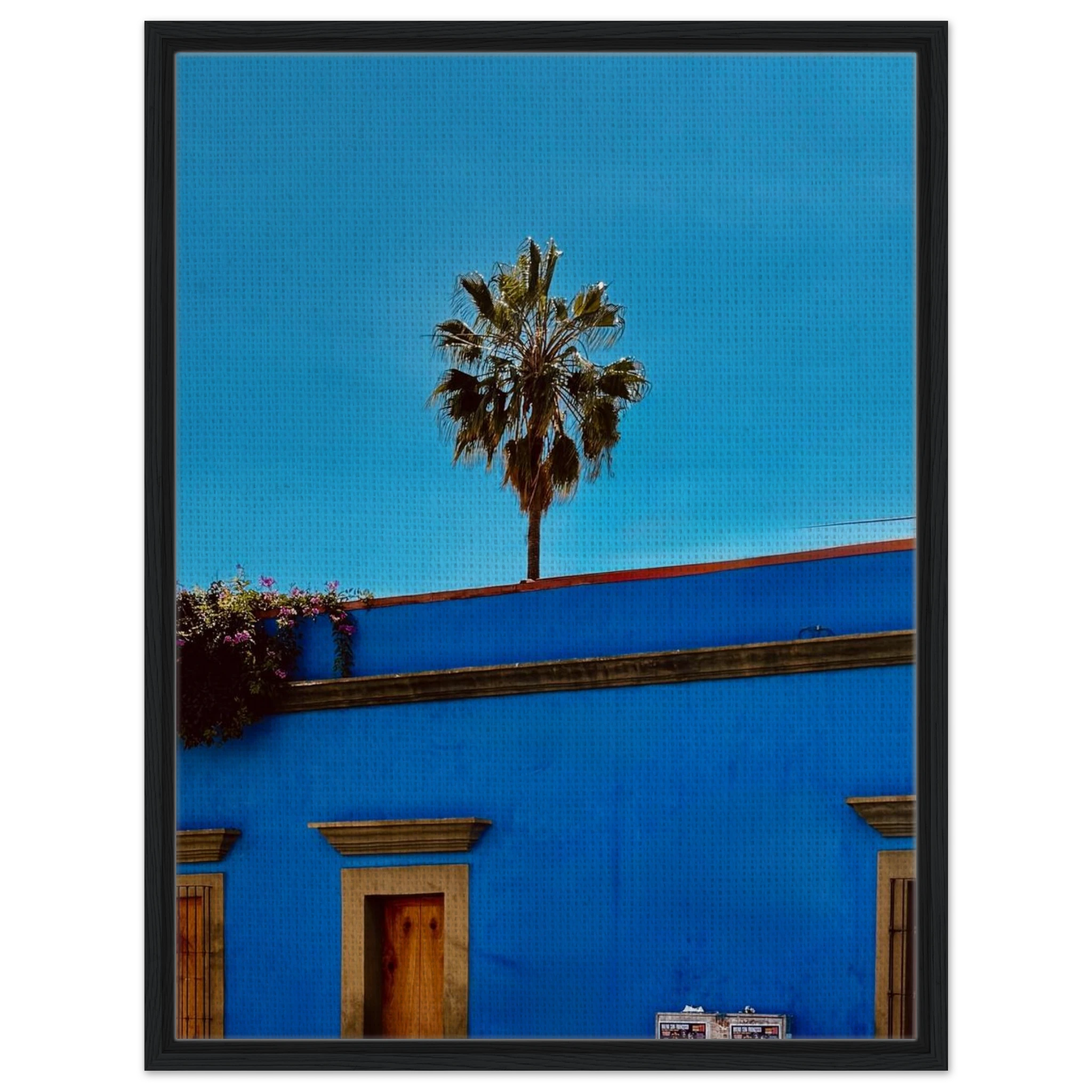 Blue framed canvas print of Oaxaca streets with palm trees, part of CaliCuration's Mexico travel collection, spring 2026 studio edition