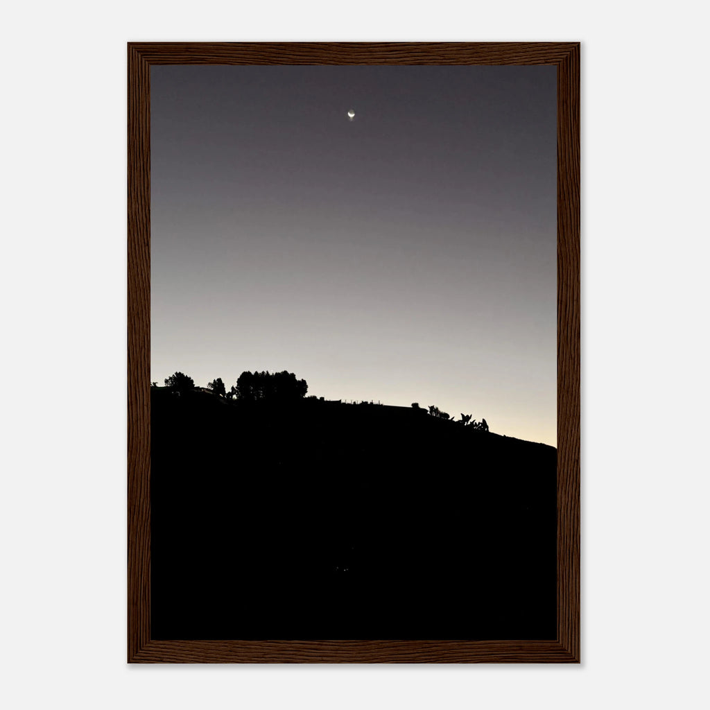 Wooden framed semi-glossy black and white poster of Hollywood Hills with a new moon, part of California poster art series.