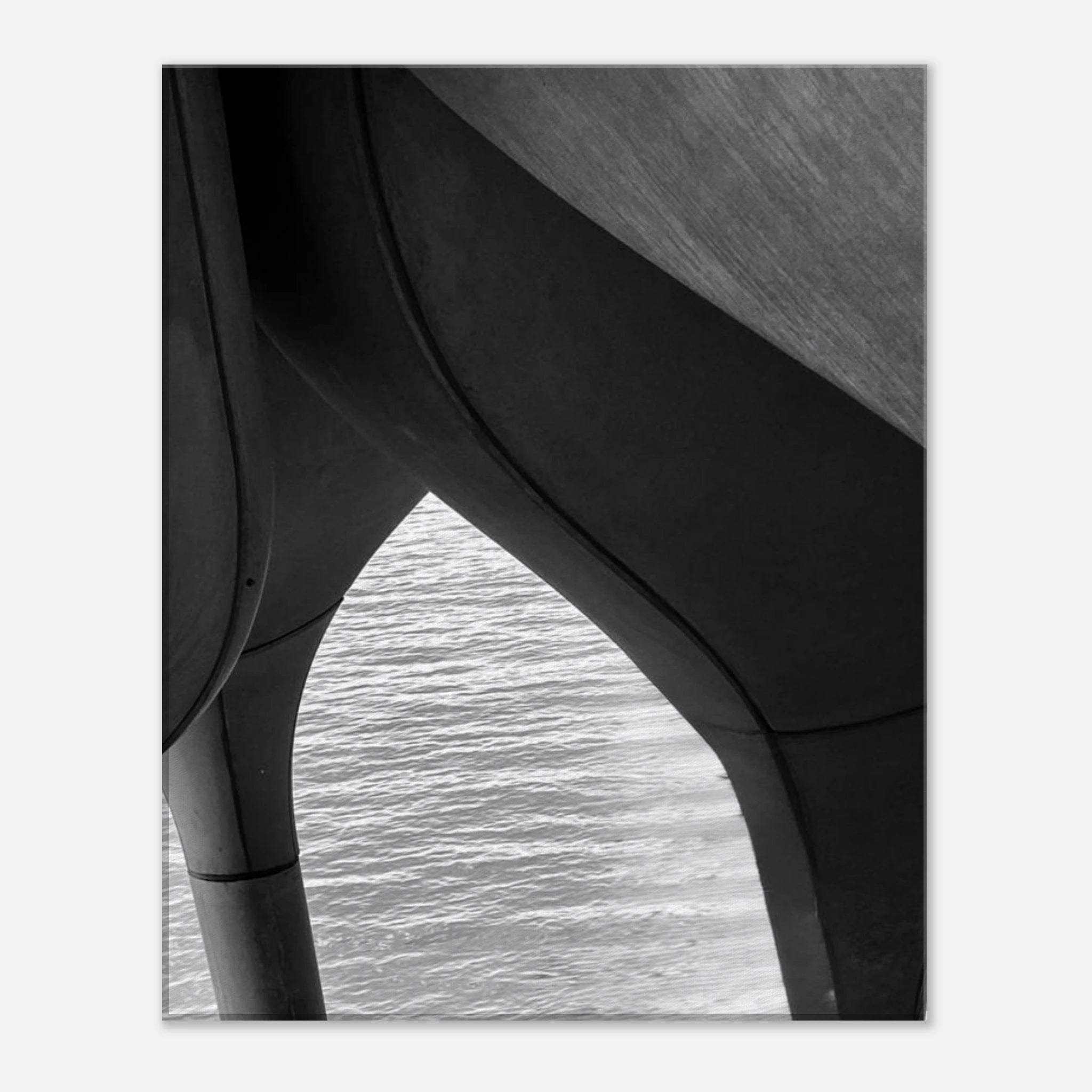 Black and white abstract canvas print of NYC Hudson River pier with high heels in water, part of Studio Edition Travel Collection.