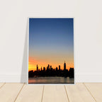 Framed Manhattan Skyline Sunset poster featuring NYC cityscape wall art on high-quality print material.