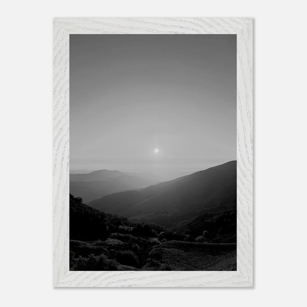 Black and white framed poster of California Central Coast sunset from the Studio Edition print collection displayed on a wall.