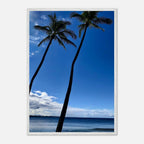 Framed Hawaii travel poster featuring iconic palm trees and Pacific waves, mounted on white frame by CaliCuration.