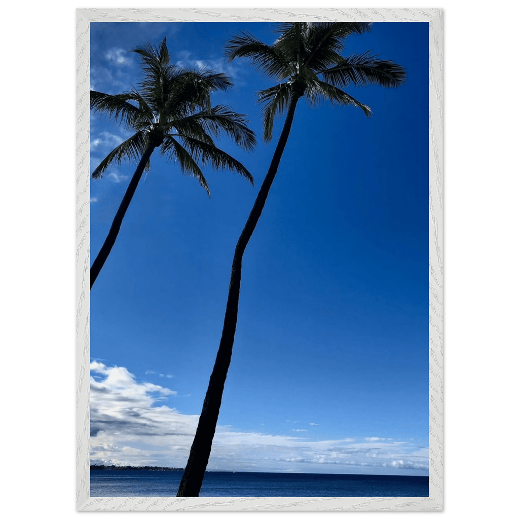 Framed Hawaii travel poster with iconic palm trees and Pacific waves, featuring a white frame and vibrant tropical scenery.