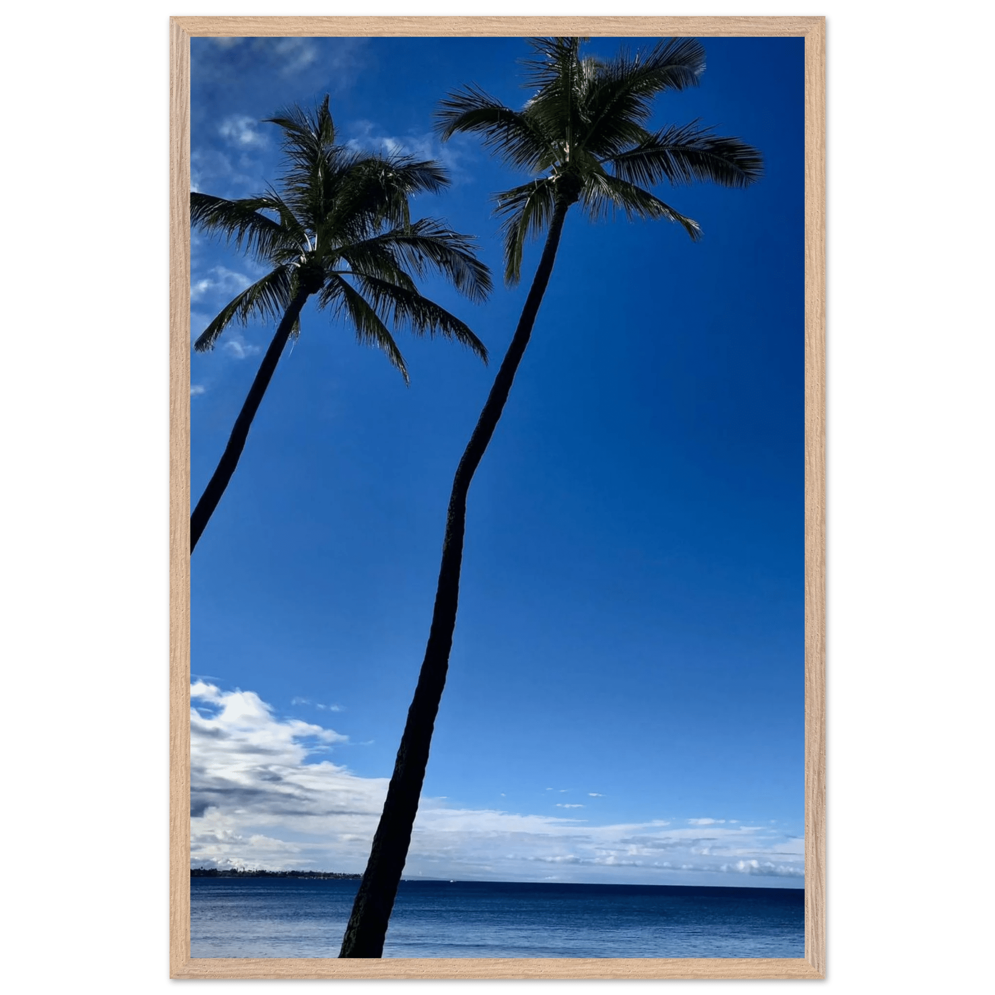 Framed print featuring iconic Hawaii palm trees and Pacific waves, mounted on white frame from CaliCuration Travel Collection.