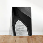 Black and white abstract canvas print of NYC Hudson River pier with high heels in water, from the Studio Edition Travel Collection.