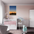 Wooden framed poster of Manhattan skyline at sunset, travel-themed wall art from the Studio Edition holiday collection.