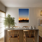 Wooden framed print of Manhattan skyline at sunset, featuring vibrant colors and cityscape details, wall art for home décor.