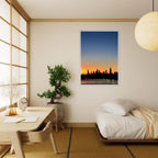 Manhattan skyline sunset framed poster, NYC wall art print on high-quality material, showcasing iconic cityscape at dusk.