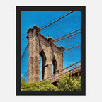 Framed print of the NYC Brooklyn Bridge featuring a Dumbo view from the Travel Collection, showcasing a vibrant summer cityscape.