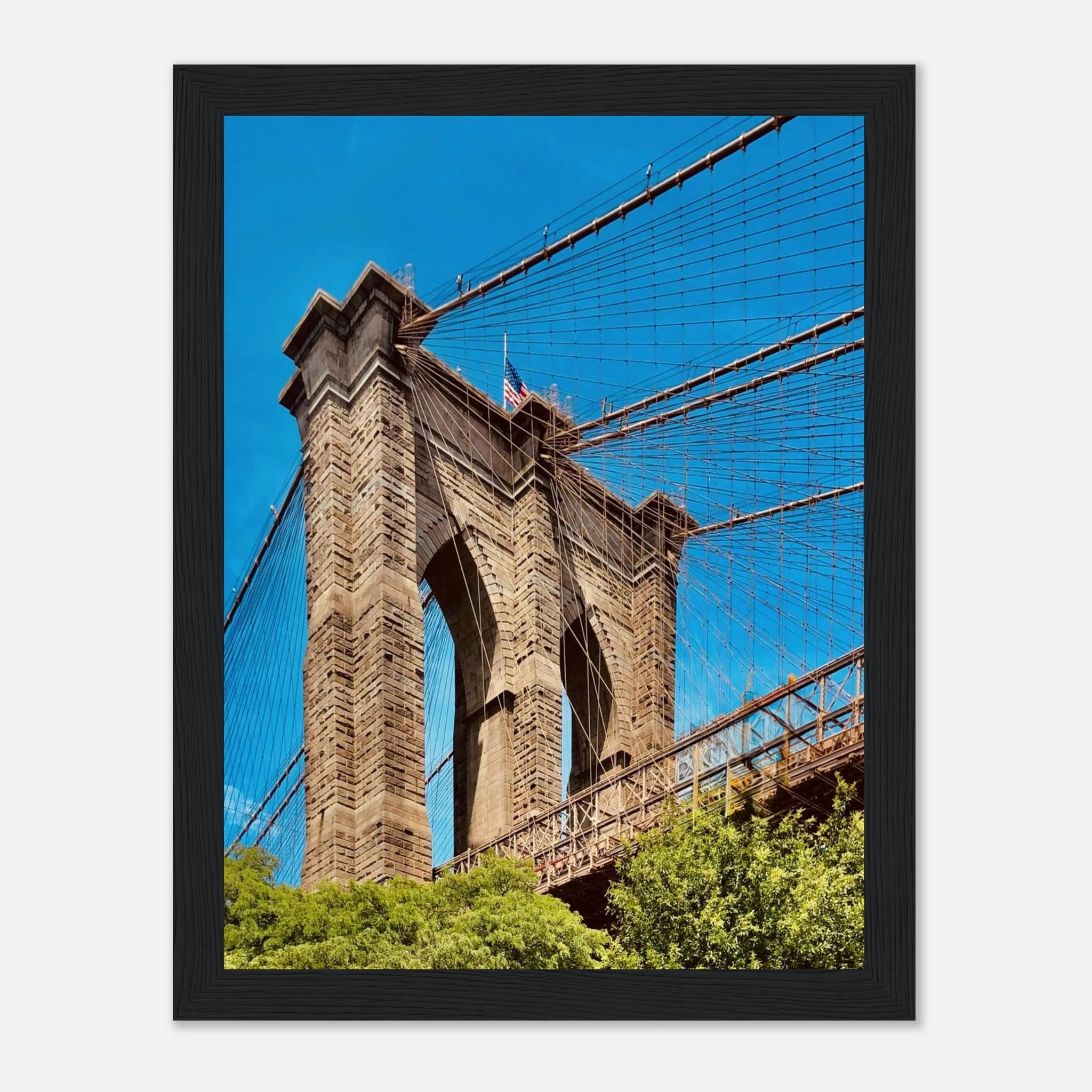 Framed print of the NYC Brooklyn Bridge featuring a Dumbo view from the Travel Collection, showcasing a vibrant summer cityscape.