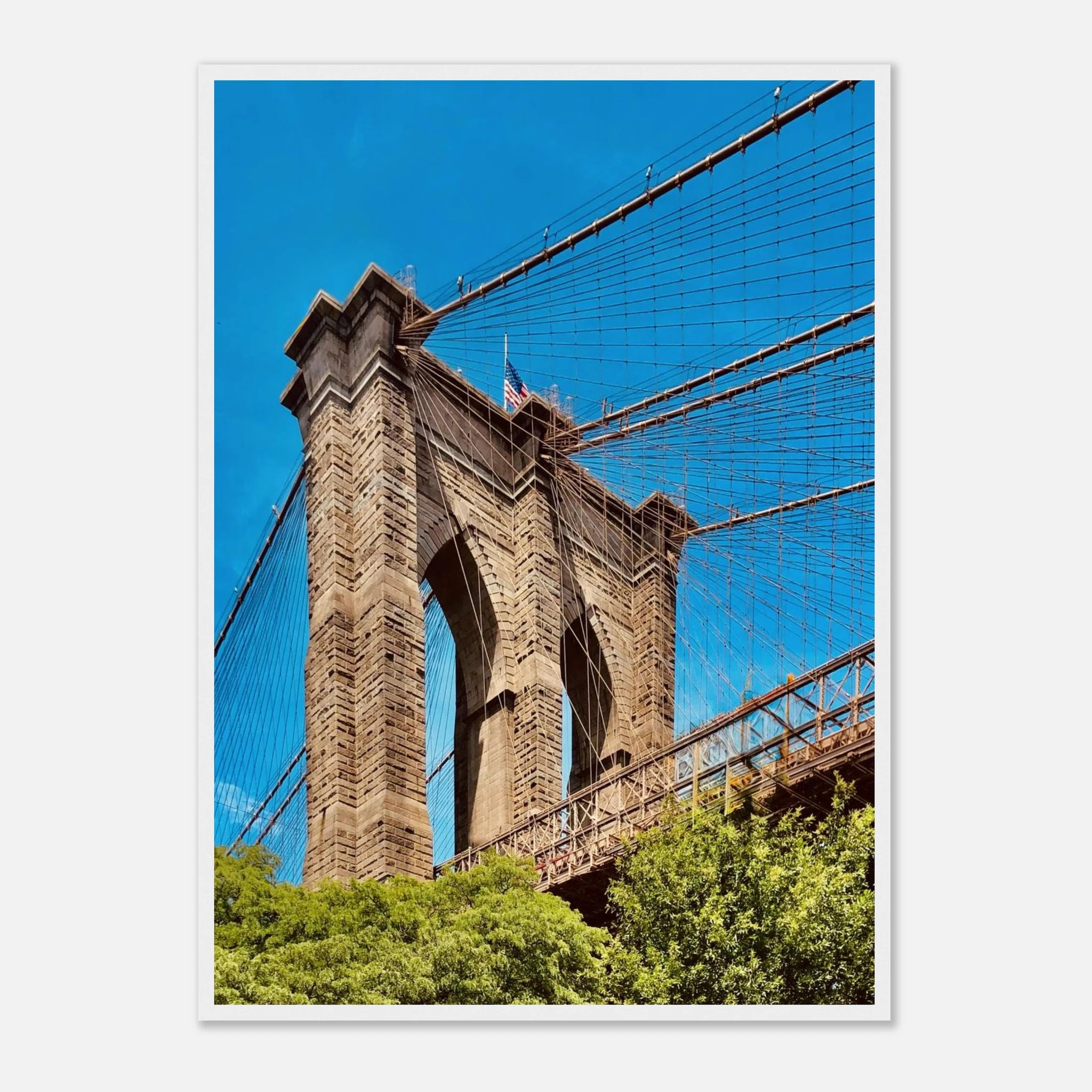 Framed NYC Brooklyn Bridge poster featuring Dumbo view, showcasing iconic New York City skyline and bridge in vibrant print material.