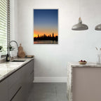 Wooden framed poster of Manhattan skyline at sunset, featuring vibrant colors and detailed cityscape wall art for home décor.