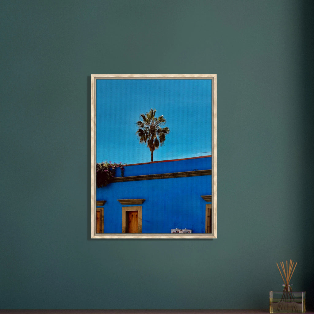 Colorful canvas print of Oaxaca streets in Mexico featuring palm trees, framed in blue, from CaliCuration's travel collection.