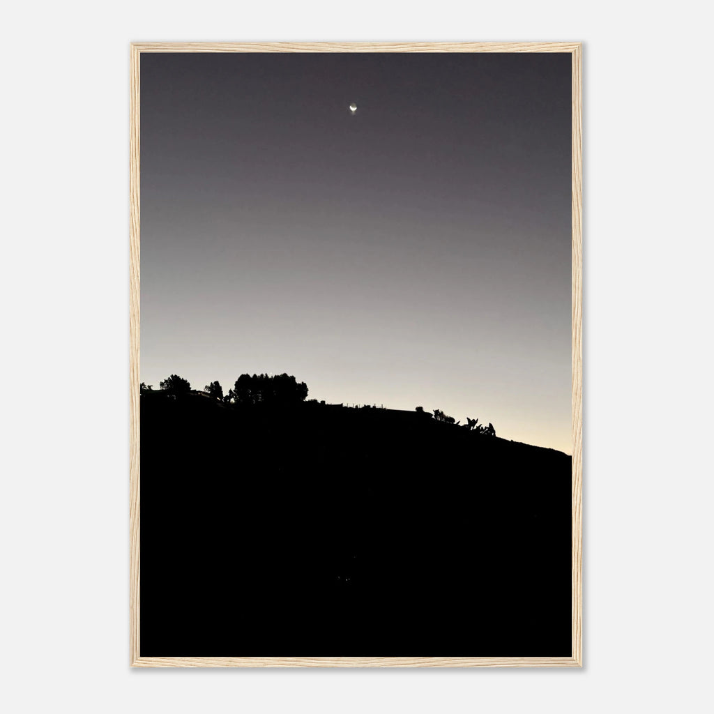 Wooden framed black and white poster of Hollywood Hills moonlit scene, part of the Fall New Moon California art series.
