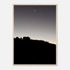 Wooden framed black and white poster of Hollywood Hills moonlit scene, part of the Fall New Moon California art series.