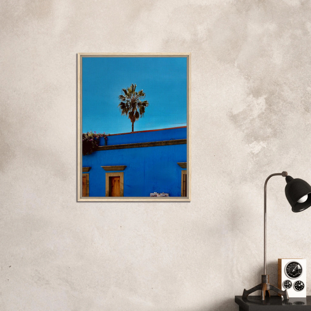 Oaxaca streets with palm trees in blue framed canvas artwork by CaliCuration, showcasing vibrant Mexican travel scenery.