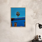 Oaxaca streets with palm trees in blue framed canvas artwork by CaliCuration, showcasing vibrant Mexican travel scenery.