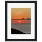 Vibrant Mediterranean Sunset framed poster print with a white frame, Coastal wall art for home decor, 15x20 cm size.