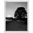 Black and white framed poster of the Cotswolds summer in the English countryside, mounted on wood with a white frame.