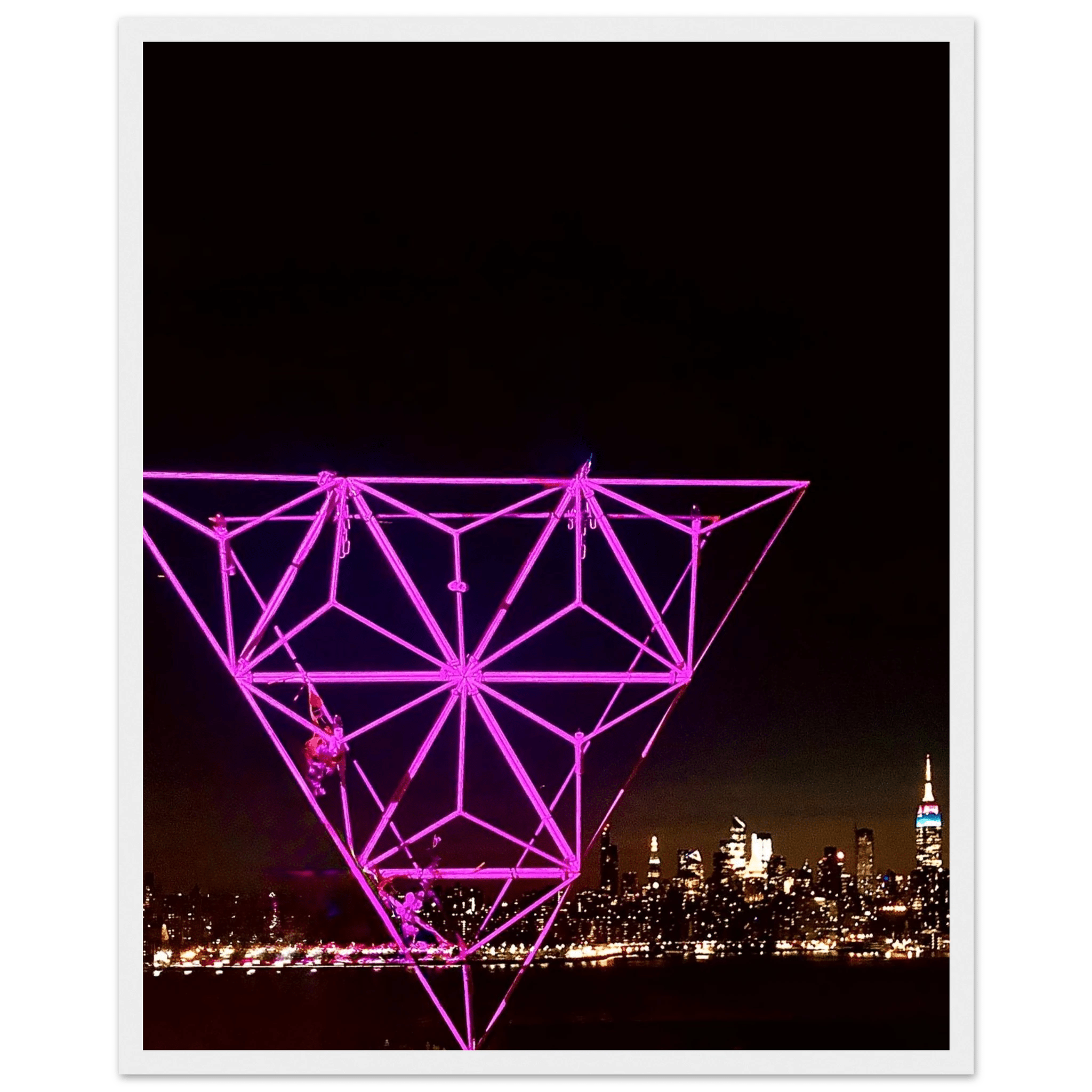 Framed print of New York City holiday purple art installation featuring a stunning Manhattan night view with Empire State Building.