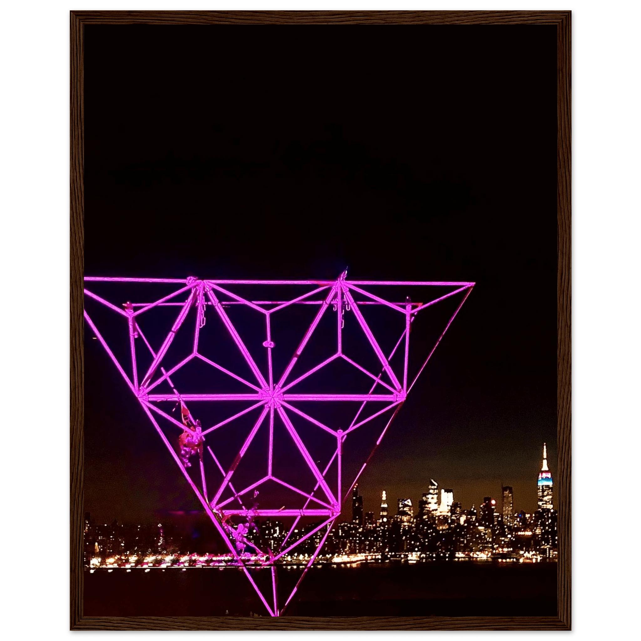 Framed print of NYC holiday purple art installation featuring Manhattan night view and Empire State Building, part of travel collection.