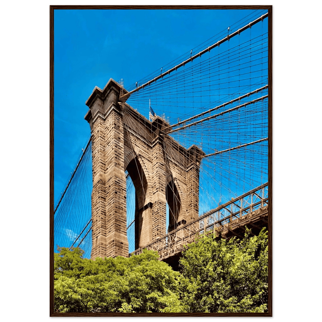Framed NYC Brooklyn Bridge poster featuring a Dumbo view, 15x20 cm print with white frame, part of the Travel Collection studio edition.