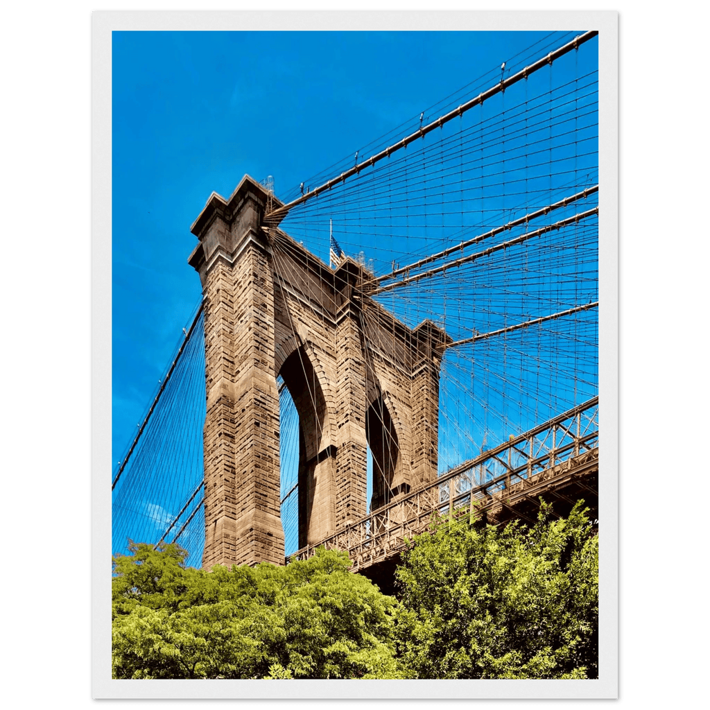 Framed NYC Brooklyn Bridge print featuring a Dumbo view, 15x20 cm, white frame, part of the Travel Collection studio edition.