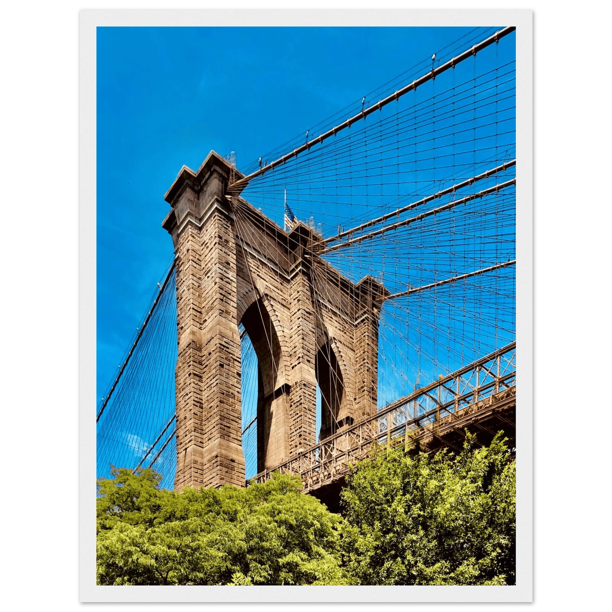 Framed NYC Brooklyn Bridge print featuring a Dumbo view, 15x20 cm, white frame, part of the Travel Collection studio edition.