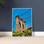 Framed NYC Brooklyn Bridge poster featuring Dumbo view, 15x20 cm print in a white frame, part of travel collection studio edition.