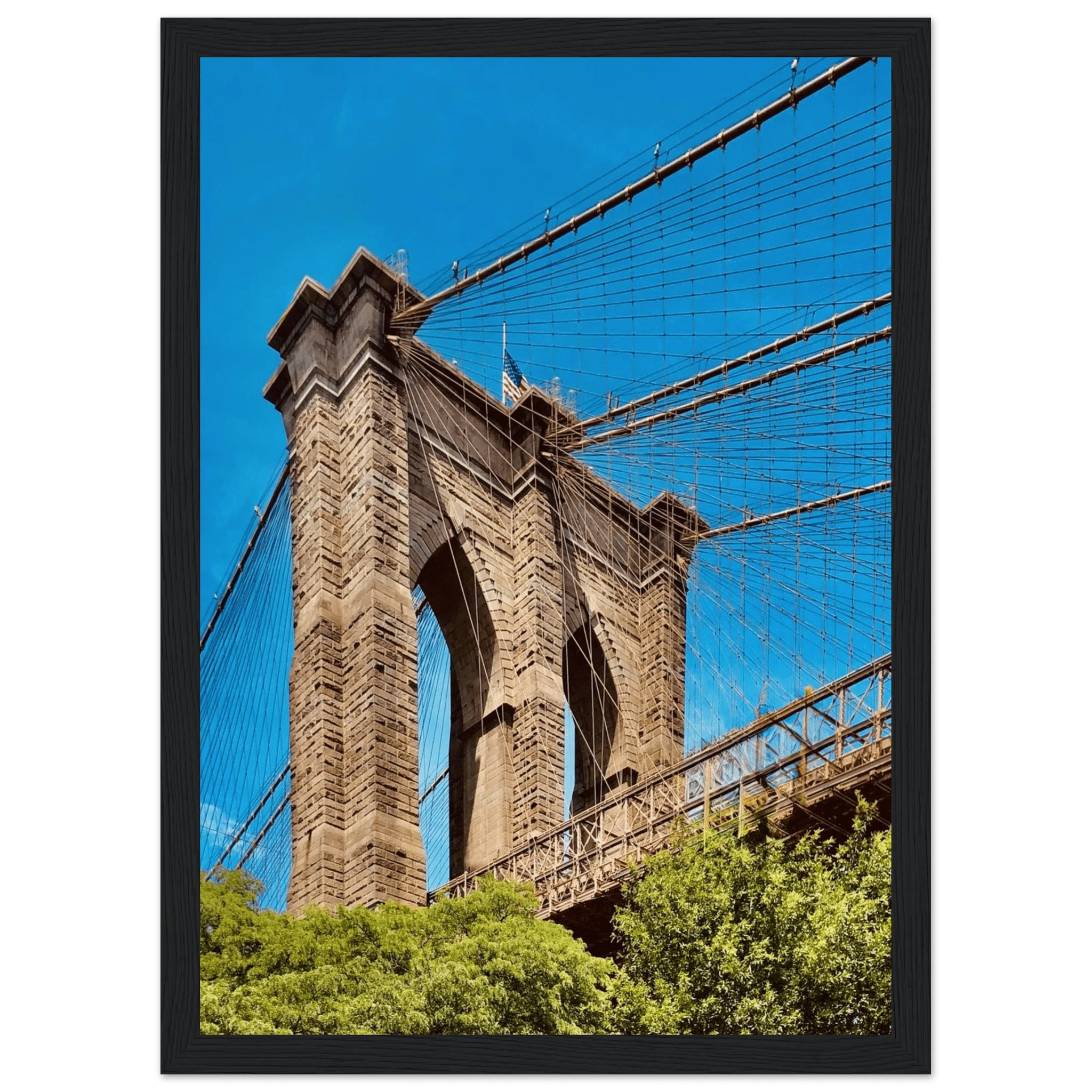 Framed NYC Brooklyn Bridge poster featuring a stunning Dumbo view, part of the Studio Edition Travel Collection display.