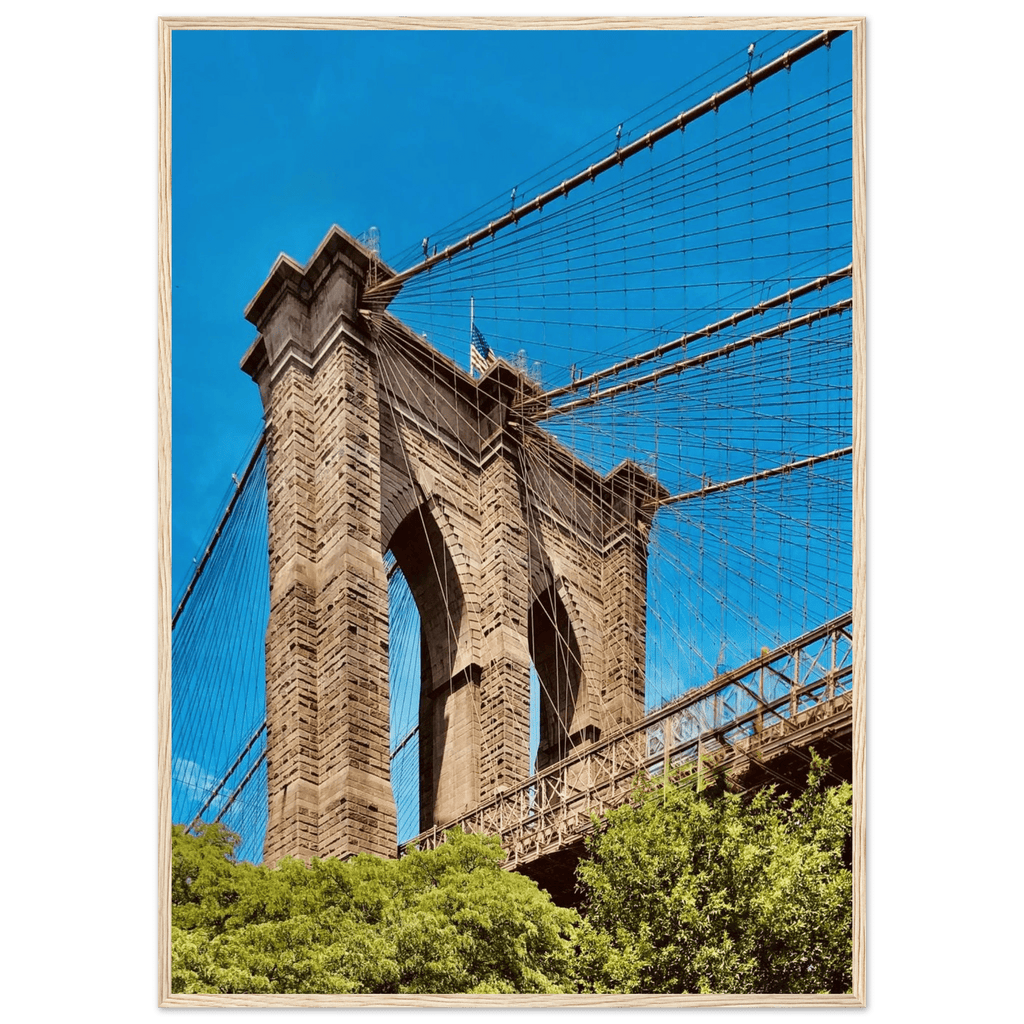 Framed NYC Brooklyn Bridge poster featuring a stunning Dumbo view, printed on high-quality material with a white frame.