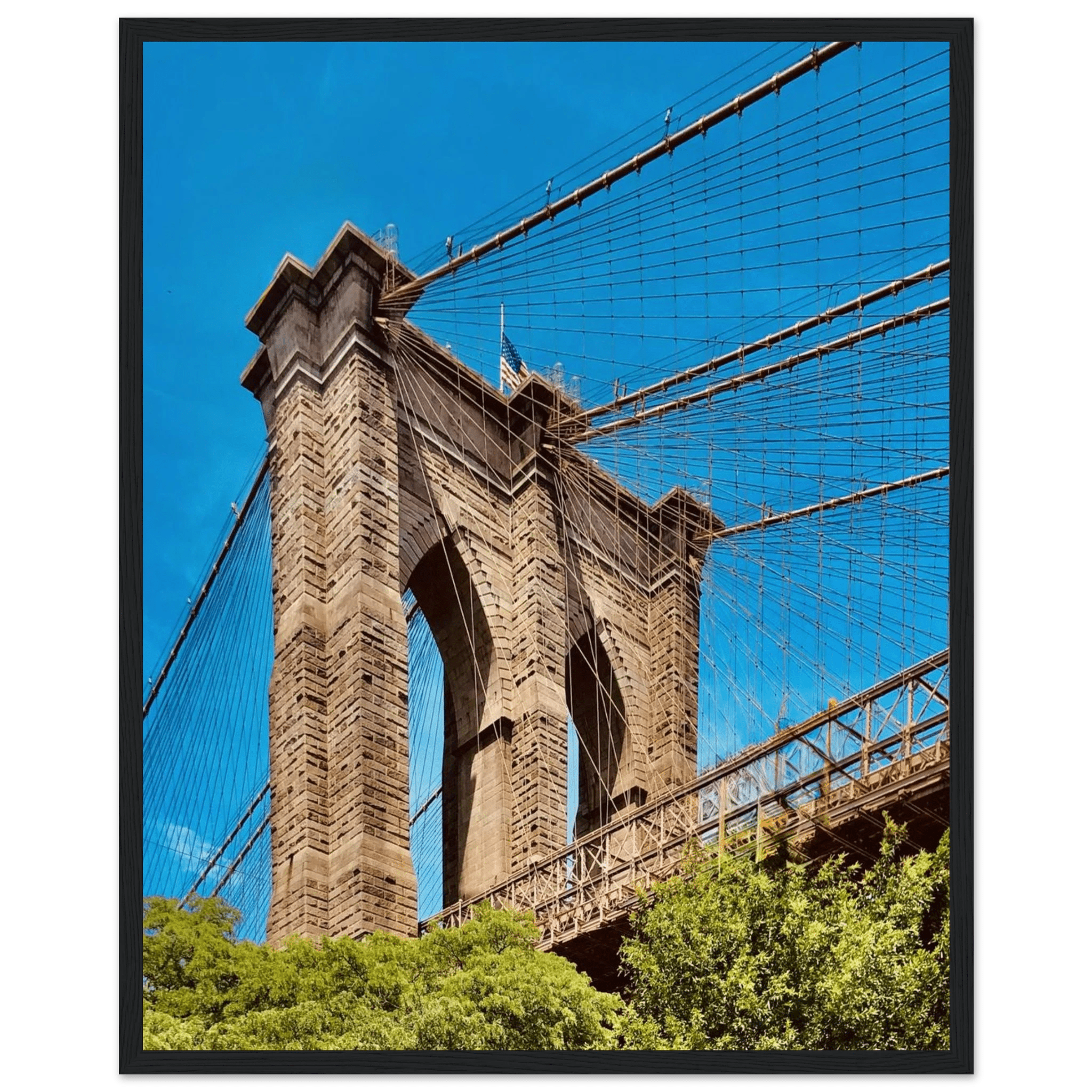 Framed NYC Brooklyn Bridge poster featuring a Dumbo view, 15x20cm print with white frame, part of travel collection studio edition.
