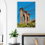 Framed NYC Brooklyn Bridge poster with Dumbo view, featuring vibrant summer cityscape, 15x20 cm print with white frame, Studio Edition.