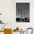 Natural wood-framed semi-glossy poster of iconic LA Westside Road, elegant black and white California wall art print.