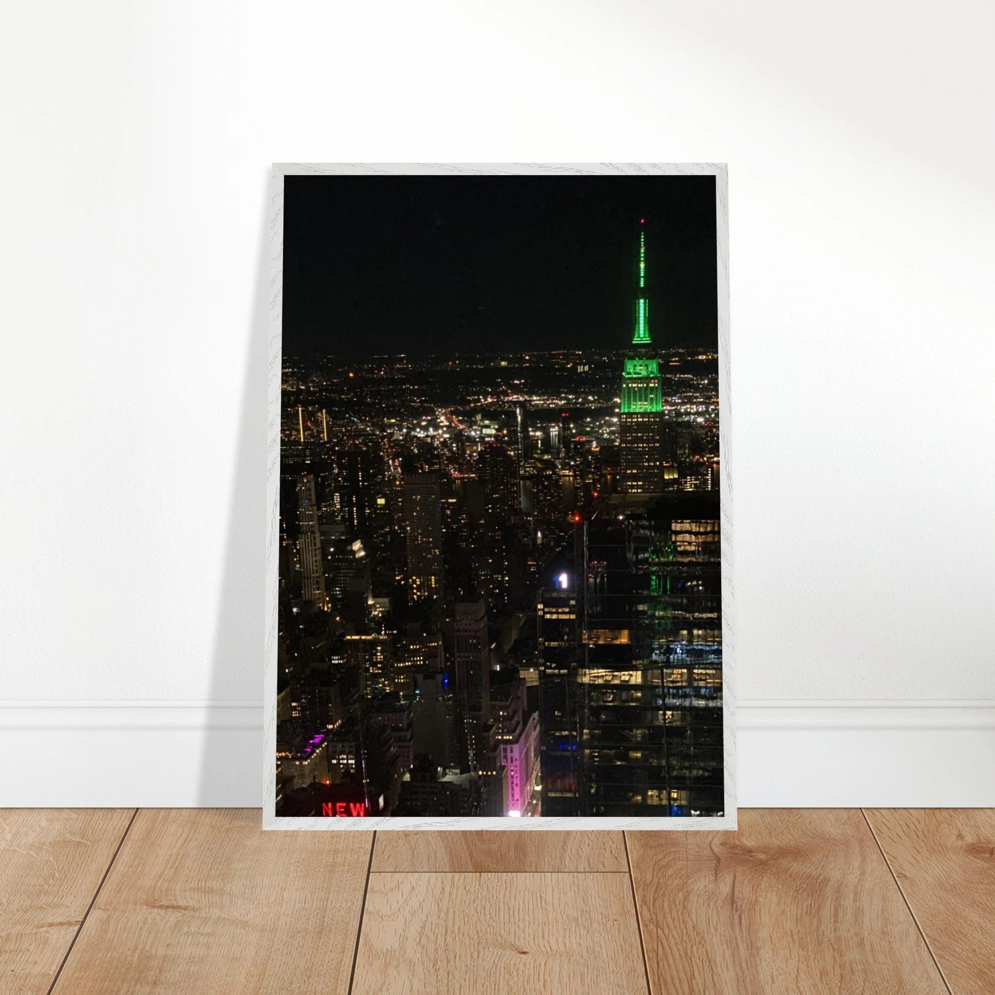 Premium wood-mounted framed poster of NYC downtown night view with Empire State Building, 15x20 cm print in white frame.