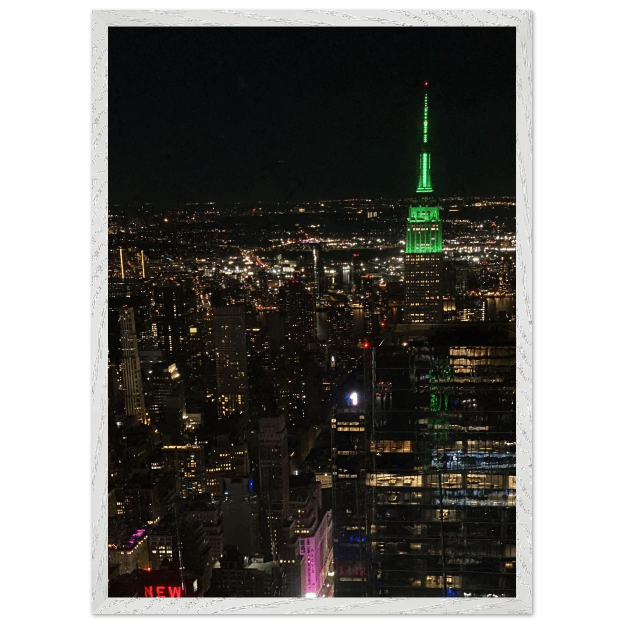 Wood-mounted framed poster of NYC downtown night view featuring the Empire State Building, part of the Travel Collection Studio Edition.