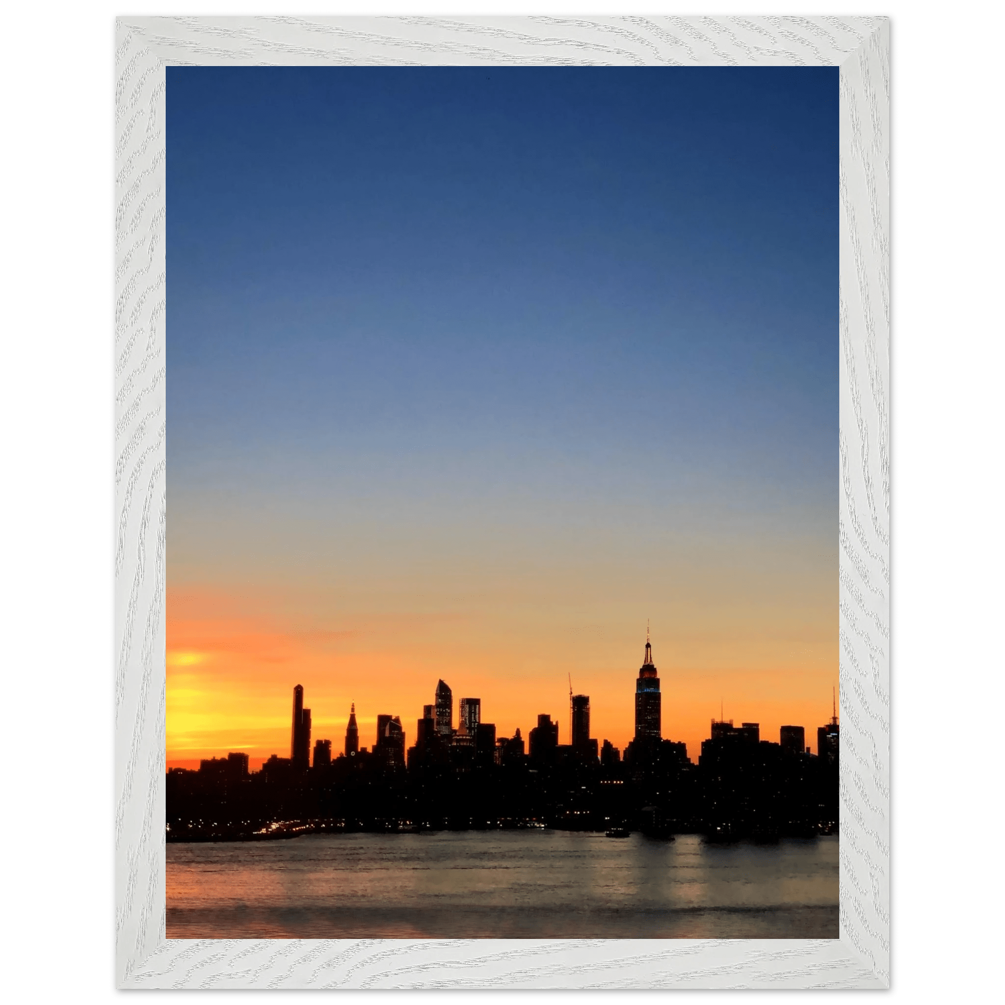Wooden framed poster of Manhattan skyline at sunset, wall art from the Travel Collection, Studio Edition, perfect for home decor.