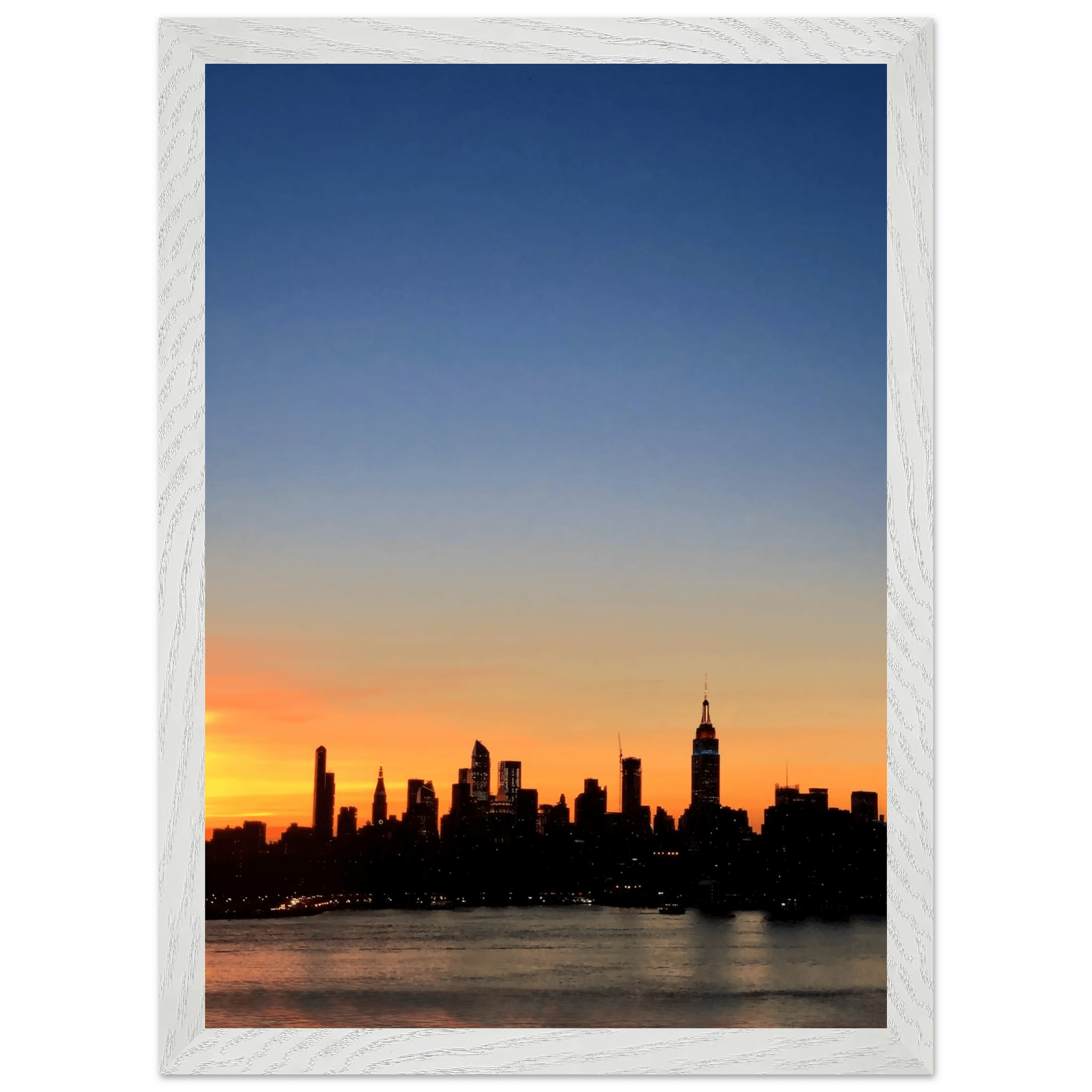 Wooden framed Manhattan Skyline sunset poster, travel-inspired wall art for home decor, featuring vibrant cityscape and warm sunset tones.
