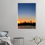 Wooden framed Manhattan Skyline Sunset poster, travel-themed wall art, featuring vibrant cityscape at sunset for home decor.
