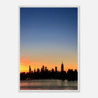Wooden framed Manhattan Skyline sunset poster from the Travel Collection, showcasing a vibrant cityscape for home decor.