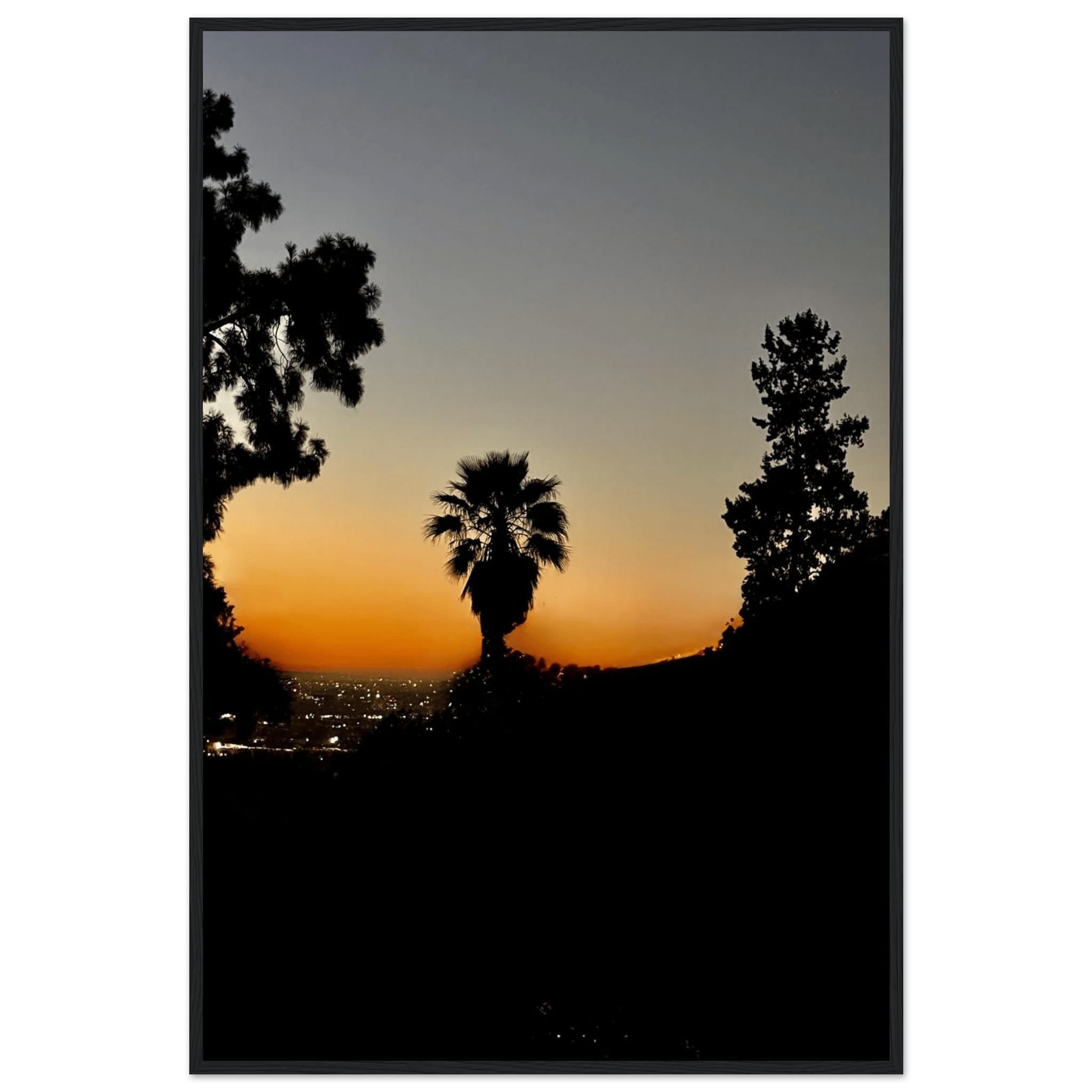 Framed print of a winter sunset over Laurel Canyon in Hollywood Hills, California, with a white frame and vibrant sunset colors.