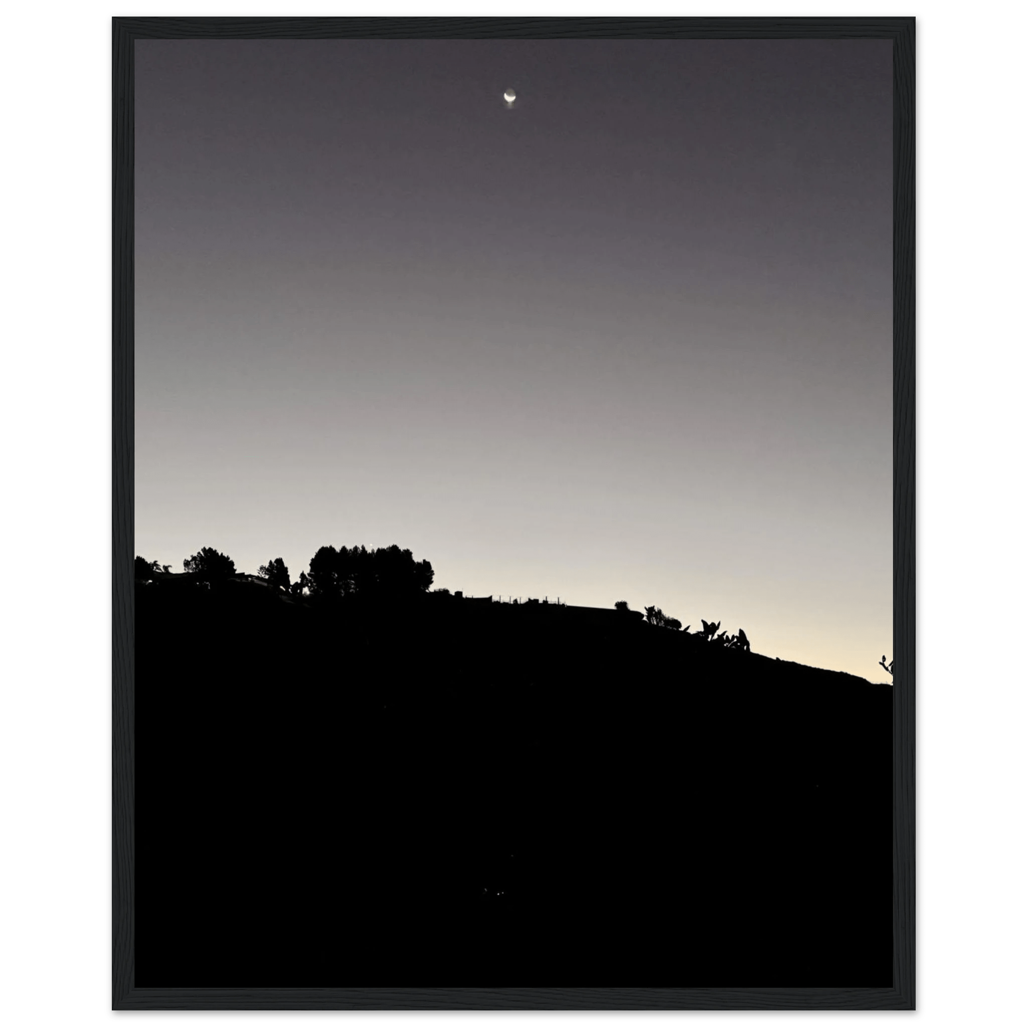Wooden framed semi-glossy poster of Fall New Moon over Hollywood Hills in black and white, California art studio edition.