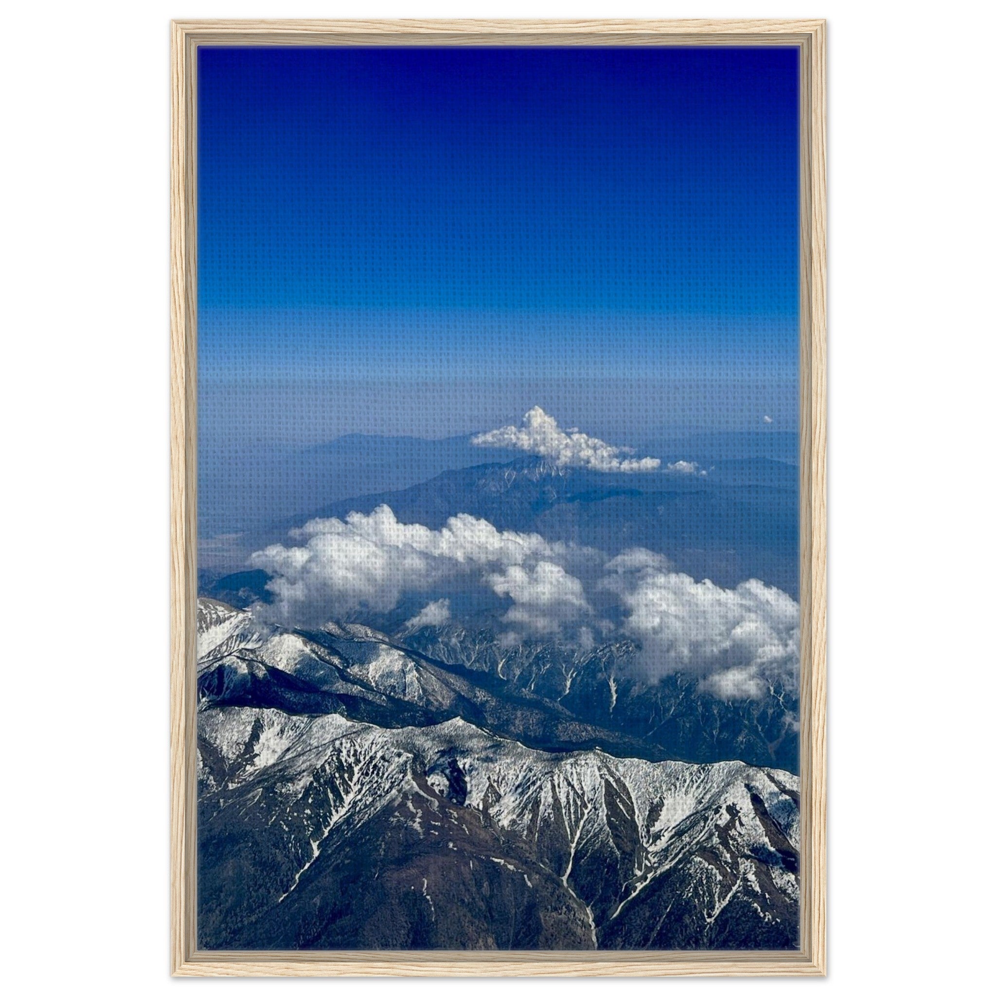 Framed canvas print of the Rocky Mountains featuring blue skies and snow-covered peaks, part of the Studio Edition travel collection.